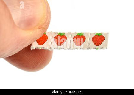 Strawberry trips-Blotting paper impregnated with the drug L.S.D.- Lysergic acid diethylamide. Stock Photo