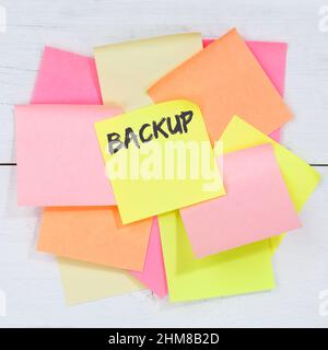 Backup save data on computer technology business concept desk note paper notepaper Stock Photo