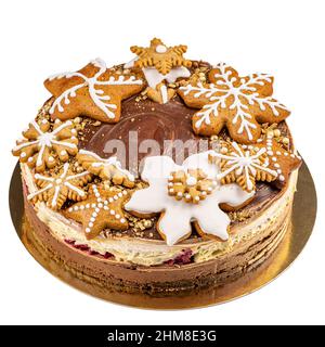 Gingerbread cake decorated with spiced Christmas cookies isolated on white background Stock Photo