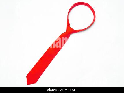 Tied red necktie isolated on a neutral background. Stock Photo