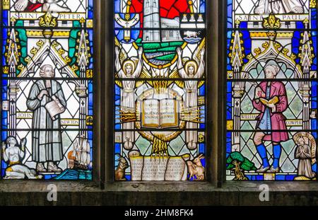 Stained glass window depicting John Newton, of Amazing Grace fame, and poet William Cowper, church of St Peter & St Paul, Olney, UK Stock Photo