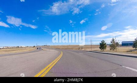 Driving on typical paved roads in suburban America. Stock Photo