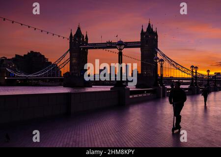 London, UK. 8th Feb, 2022. UK Weather. Spectacular sunrise colours over Tower Bridge and the City. Credit: Celia McMahon/Alamy Live News Stock Photo