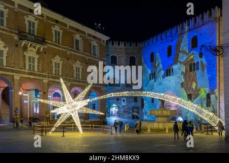 Piazza del Comune square, bright artistic Christmas decorations, Video Mapping on the Palazzo del Podestà Fabriano, Marche, Italy, Europe Stock Photo