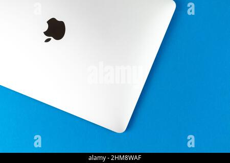 Apple Macbook on bright table background. Business and office concept, top view, flat lay Stock Photo