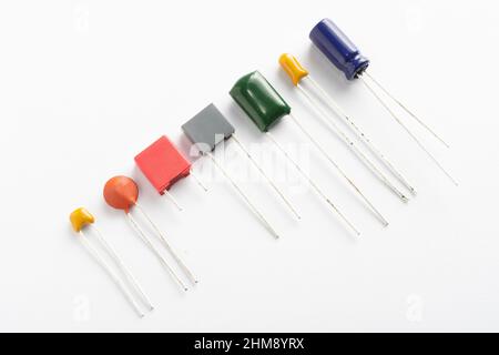 Different types of ceramic, film, tantalum and electrolytic capacitors on white background Stock Photo