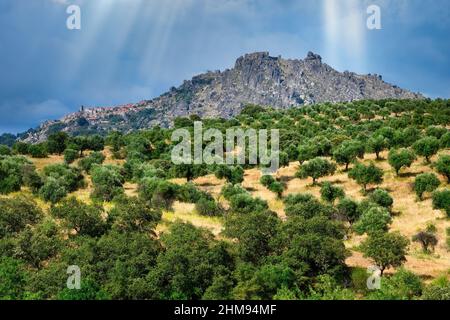 View over the landscape surrounding Idanha-a-Velha village with the village of Monsanto at the top of the hill in the background, Serra da Estrela, Be Stock Photo
