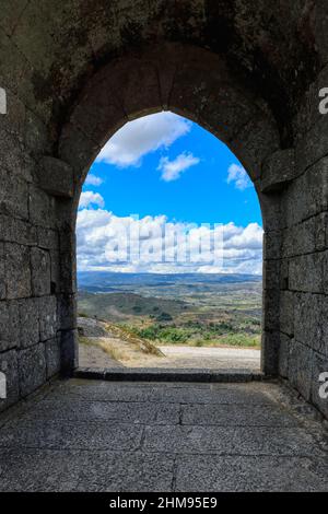 Landscape around Sortelha viewed through an entrance gate, Serra da Estrela, Beira Alta, Portugal Stock Photo