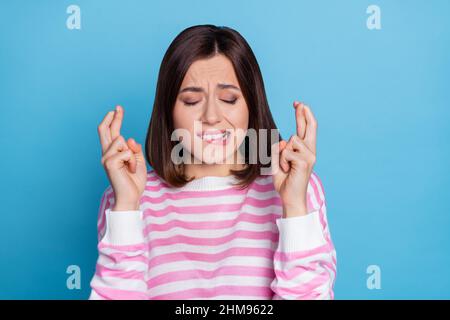 Photo of stressed young bob hairdo lady bite lip wear striped shirt isolated on blue color background Stock Photo