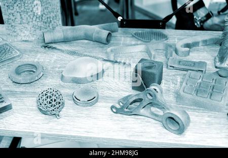 Different gray models printed on 3d printer from powder close-up. Stock Photo