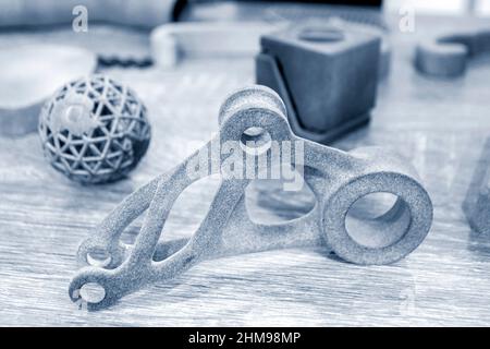 Different Abstract objects printed on powder 3D printer. Multi Jet Fusion MJF. Stock Photo