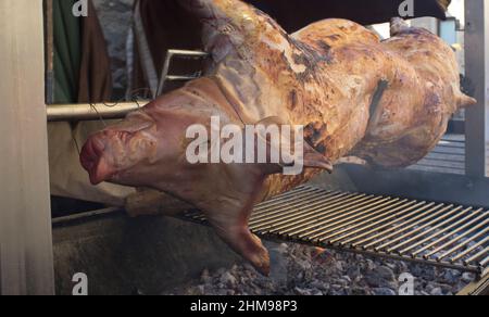 Whole pig being roasted as medieval times. Selective focus Stock Photo