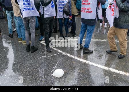 February 8, 2022: The Turkish Medical Association and medical chambers organized a strike named 'White Mission/Strike'' across Turkey on February 8, 2022, within the scope of the struggle program titled 'Labor is Our Word,Â Keep Fighting Until We Get What Is Our Right''. Health workers at Istanbul Capa Medical Faculty held a protest and march under heavy rain and made a press statement. In addition to their demands for low salaries, personal rights and the implementation of laws containing violence against health personnel, health workers who wanted Covid 19 to be considered an occupatio Stock Photo