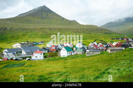 village of Gjogv with typically colourful houses on the Eysturoy island, Faroe Islands, Denmark. Stock Photo