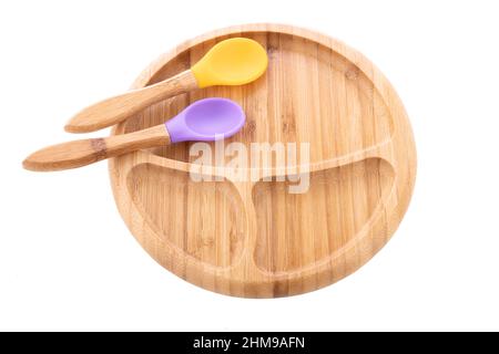 Wooden bowl. Bamboo plate with spoon isolated on whit background Stock Photo