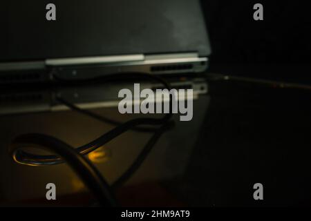Ethernet cable plugged into a laptop Stock Photo