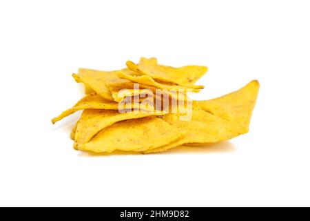 nachos, corn chips, snack isolated on white background. Scattered fast food, suitable for vegetarians. Traditional mexican food. Selective focus Stock Photo