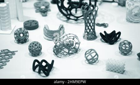 Many abstract models bright colorful objects printed on a 3d printer ...