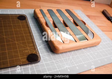 Tanner tools. Handmade Skiving knife and awl Stock Photo - Alamy