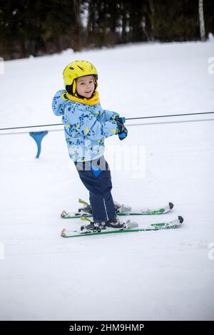 Cute little boy skiing on slope Stock Photo - Alamy