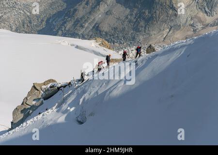 Climbing to the Aiguille du Midi viewing platform above Chamonix ...