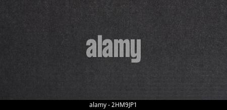 Surface of dark grey paper texture macro close up view Stock Photo