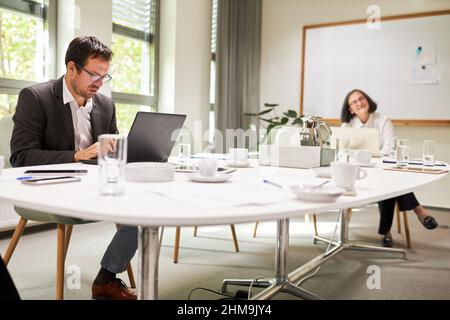 Business people at the conference table in a break in the office in the conference room of an agency or company Stock Photo
