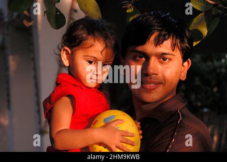 Mayurvan, Mumbai,  Maharashtra, India- Asia, Oct, 2008 : Family father and child enjoying outdoor nature. Stock Photo