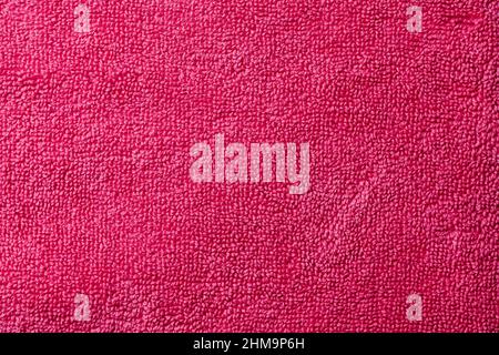closeup of a red purple or fuchsia terrycloth fabric to be used as a background Stock Photo