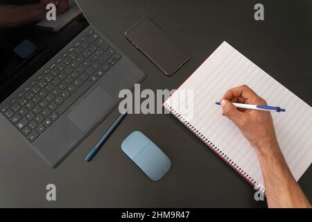 A image of somebody ready to take notes from studying or working from home Stock Photo
