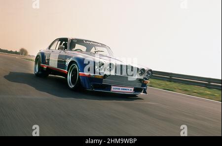 1976 Jaguar XJ12C racing car built by Broadspeed, testing at Silverstone race track YK Stock Photo