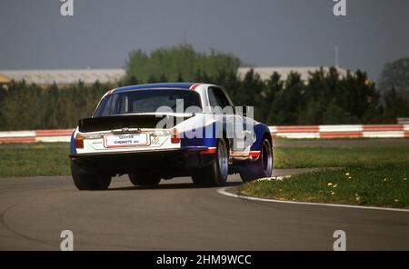 1976 Jaguar XJ12C racing car built by Broadspeed, testing at Silverstone race track YK Stock Photo