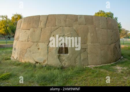 Remains of the Bronze Age round tomb with human and animal figures carved on it Hili Archaeological Site in Al Ain, Emirate of Abu Dhabi Stock Photo