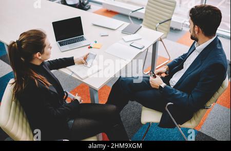 Business colleagues discussing project in office Stock Photo