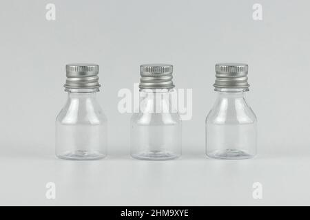 transparent glass small bottles isolated for your text and design. unbranded transparent glass small bottles isolated template copy space Stock Photo