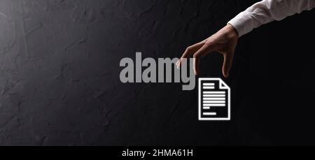 Hand holding a document icon in his hand Document Management Data System Business Internet Technology Concept. Corporate data management system DMS. Stock Photo