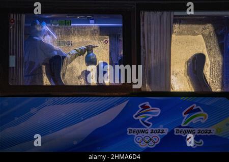 Cang Tia Kchou, China. 08th Feb, 2022. Staff member disinfects bus at Zhangjiakou, China, on February 8, 2022, during the 2022 Winter Olympics. Credit: Roman Vondrous/CTK Photo/Alamy Live News Stock Photo