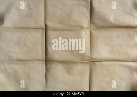Old folded brown yellow paper texture background Stock Photo