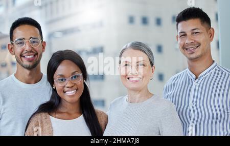 My staff deserve all the best. Shot of a diverse group of work colleagues together in their office. Stock Photo