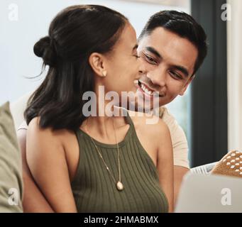 You are my sun, my moon, and stars. Shot of a couple holding each other at home. Stock Photo