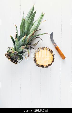 Pineapple on white wood board with copy space Stock Photo