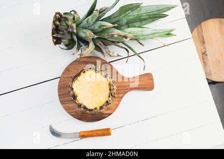 Pineapple on white wood background. Pineapple with copy space Stock Photo