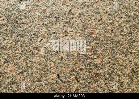 Gray black brown combination granite floor stone rough background. Granite pebble studded backdrop photos Stock Photo