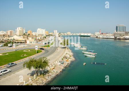 View over the Corniche Al Qawasim and the harbor in the city of Ras Al Khaimah (RAK) or Julfar, the capital of the Emirate of Ras Al Khaimah in UAE Stock Photo