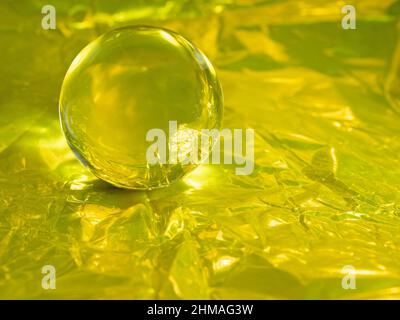 Crystal Ball on Golden Foil Stock Photo