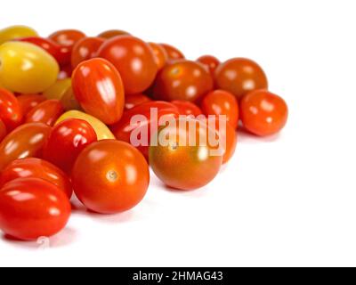 Various mini tomatoes against a white background Stock Photo
