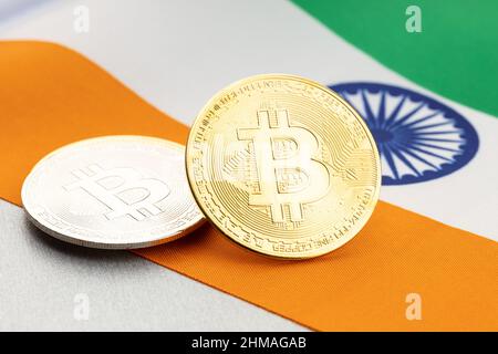 Bitcoin cryptocurrency coins on national flag of India. Crypto law regulation concept Stock Photo
