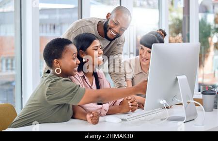 Everyone is laying their ideas on the table. Shot of a group of businesspeople discussing something on a desktop. Stock Photo