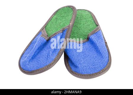 Slippers made of felt have a blue-green color. Isolated over white background. Close-up. Stock Photo