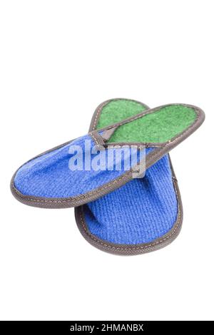 Slippers made of felt have a blue-green color. Isolated over white background. Close-up. Stock Photo